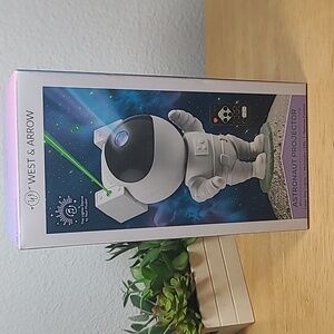 West & Arrow Astronaut Projector with dancing lights to music